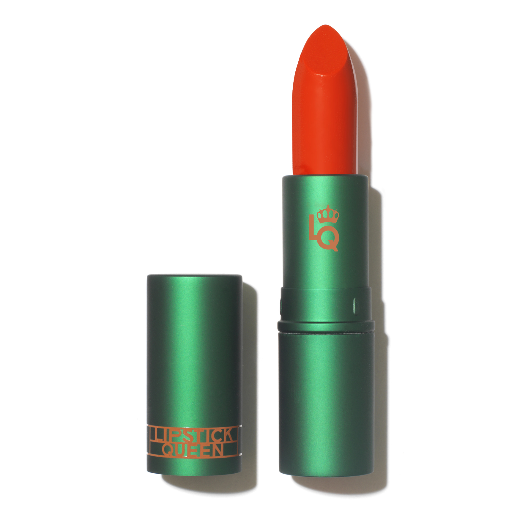 image of Lipstick Queens Jungle Queen lipstick - a bright red based coral lipstick (in green packaging) that looks amazing on dark skin 